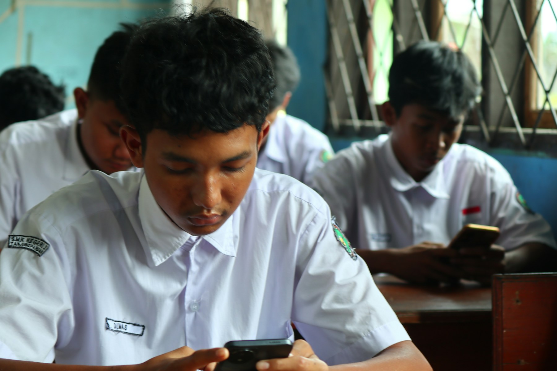 Students using smartphones in a classroom