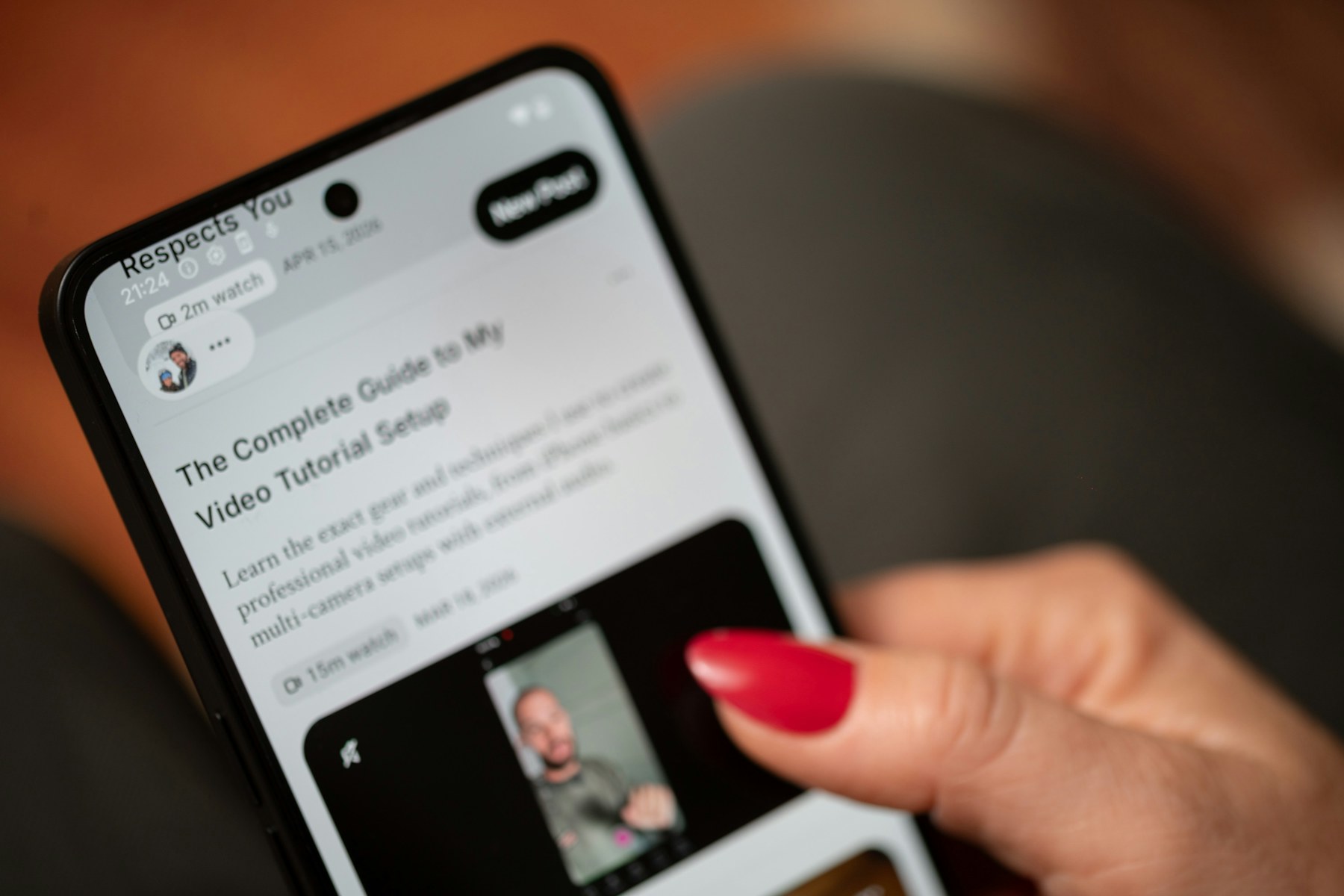 A hand scrolling through content on a smartphone